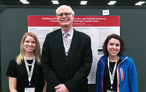 Outreach specialists present their research at a national conference