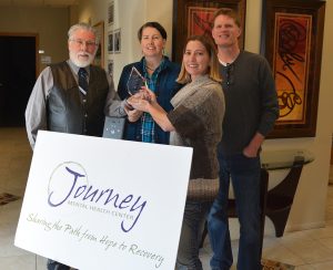 Journey Mental Health accepts an award for helping their patients live tobacco-free. 
