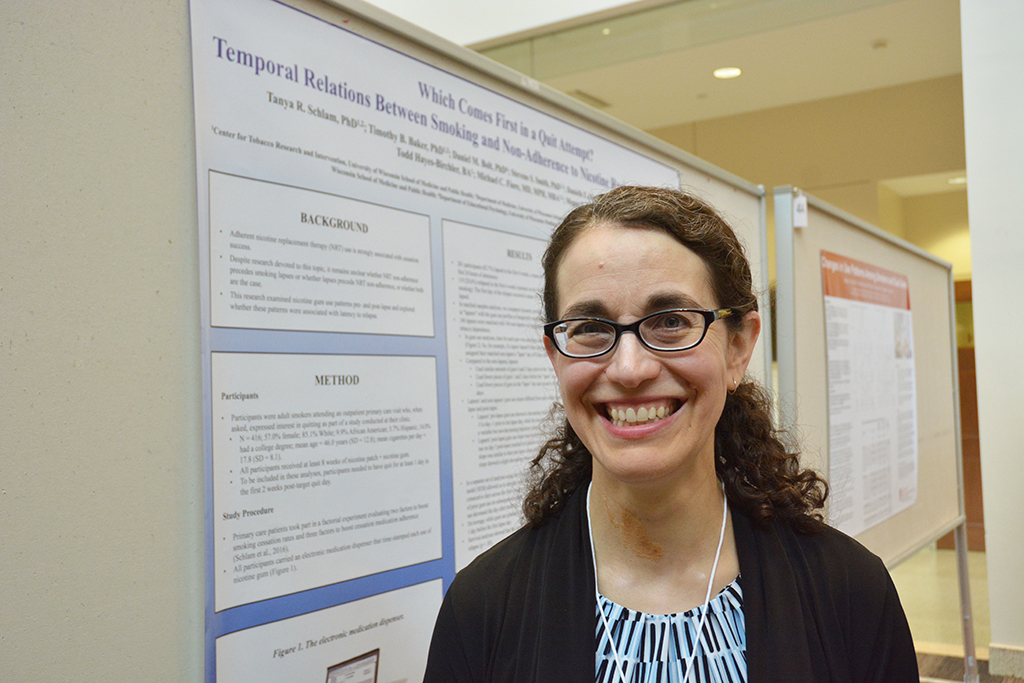 Dr. Tanya Schlam with her award-winning poster