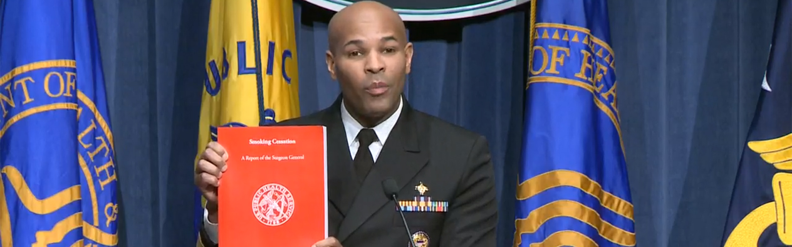 US Surgeon General Dr. Jerome Adams shows his new report