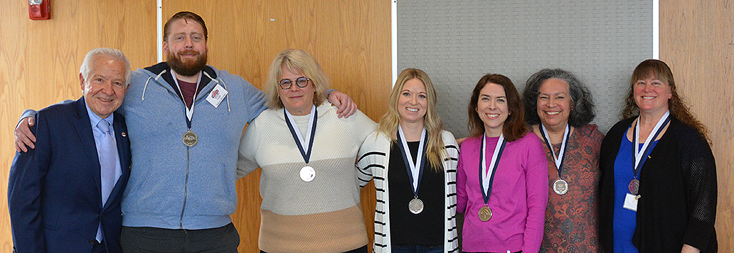 From left: Dr. Michael Fiore honored colleagues who earned 10-year service medals: Todd Hayes-Birchler, Holly Prince, Amy Skora, Allison Gorrilla, Kathleen Cantu, and Renae Borkowski