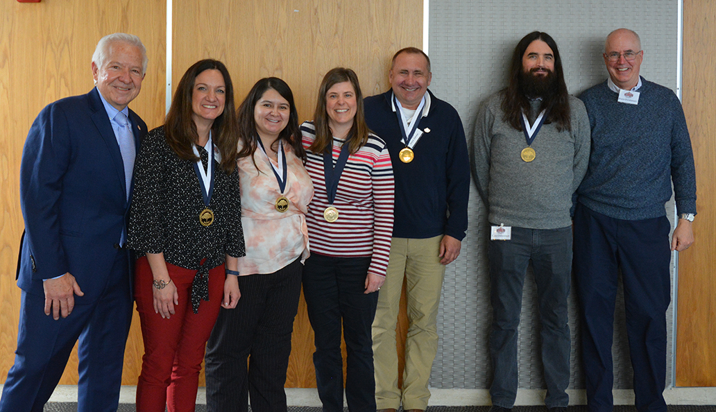 From Left: Dr. Michael Fiore joined colleagues who received their 15-year service medals including Meg Feyen, Mari Marquez, Kate Kobinsky, Mark Zehner, T.Jay Christenson, and Dr. Bruce Christiansen. 
