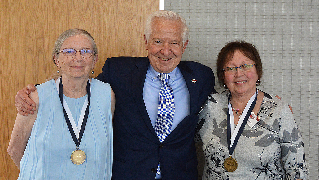 UW-CTRI colleagues and 20-year medal awardees Dr. Wendy Theobald (left) and Marie Larson joined Dr. Michael Fiore. 