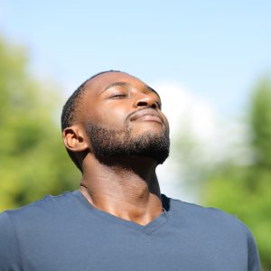 man breathes fresh air